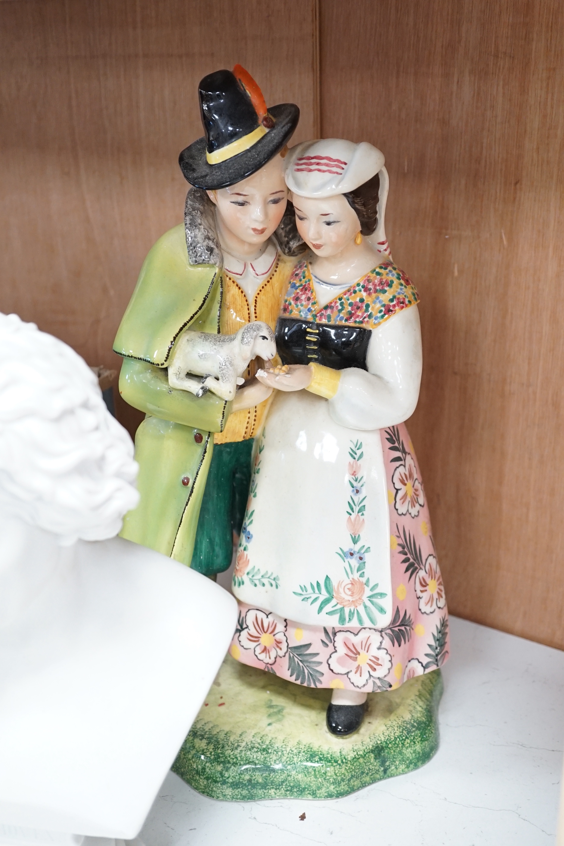 Eight porcelain figures including a pair of German style figures, a large Figo group, feeding a lamb, two Chinese figures, a bust of Beethoven, etc. largest 37cm